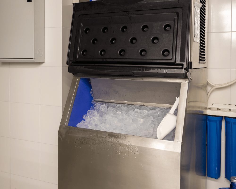 Commercial ice machine bin filled with fresh ice