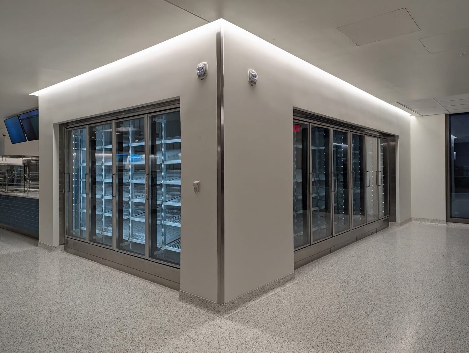 Newly installed walk-in cooler with glass merchandising doors