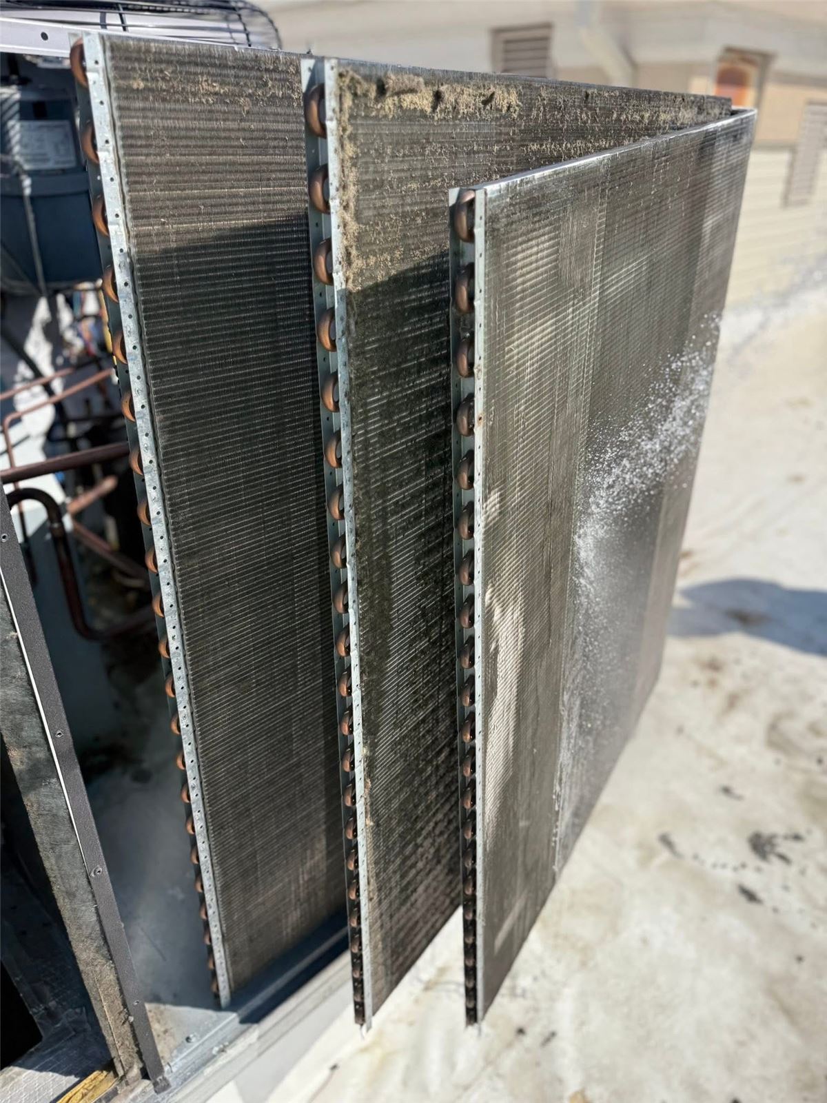 HVAC coils removed for cleaning during a preventive maintenance visit